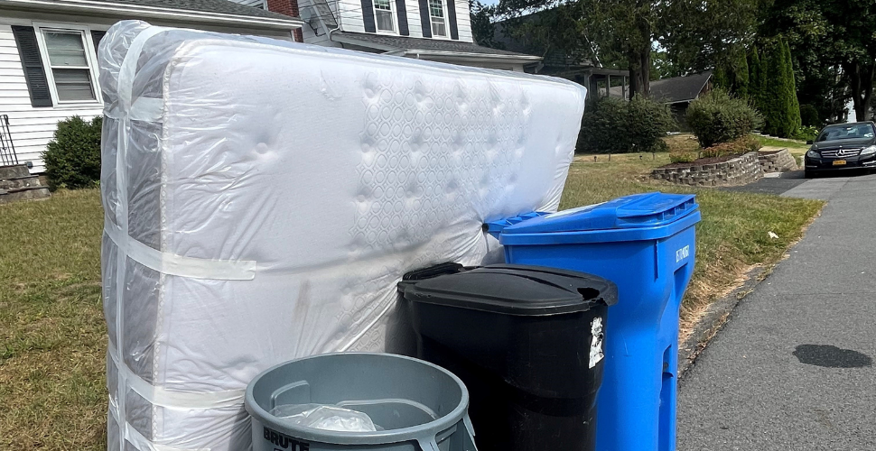Mattress disposal with protective covering, taped and sealed.