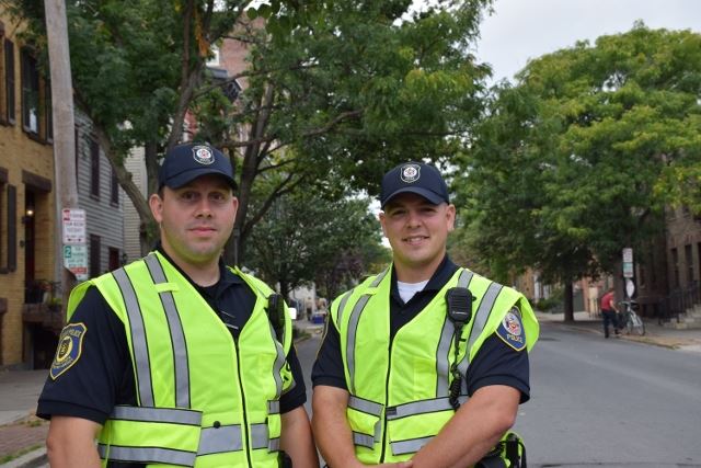 Two Officers Wearing Yellow Safety Vests